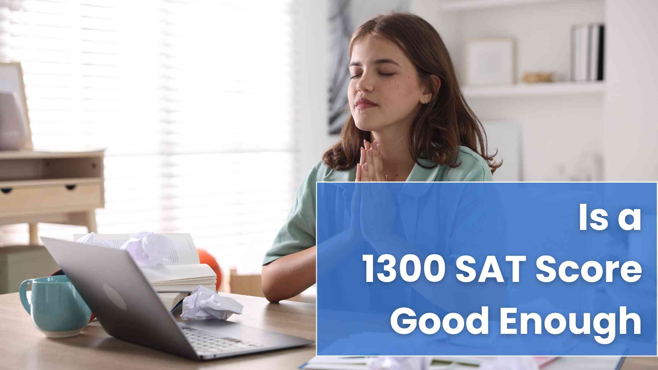 Student at desk with laptop and papers appears stressed while considering if a 1300 SAT score is good for college admission.