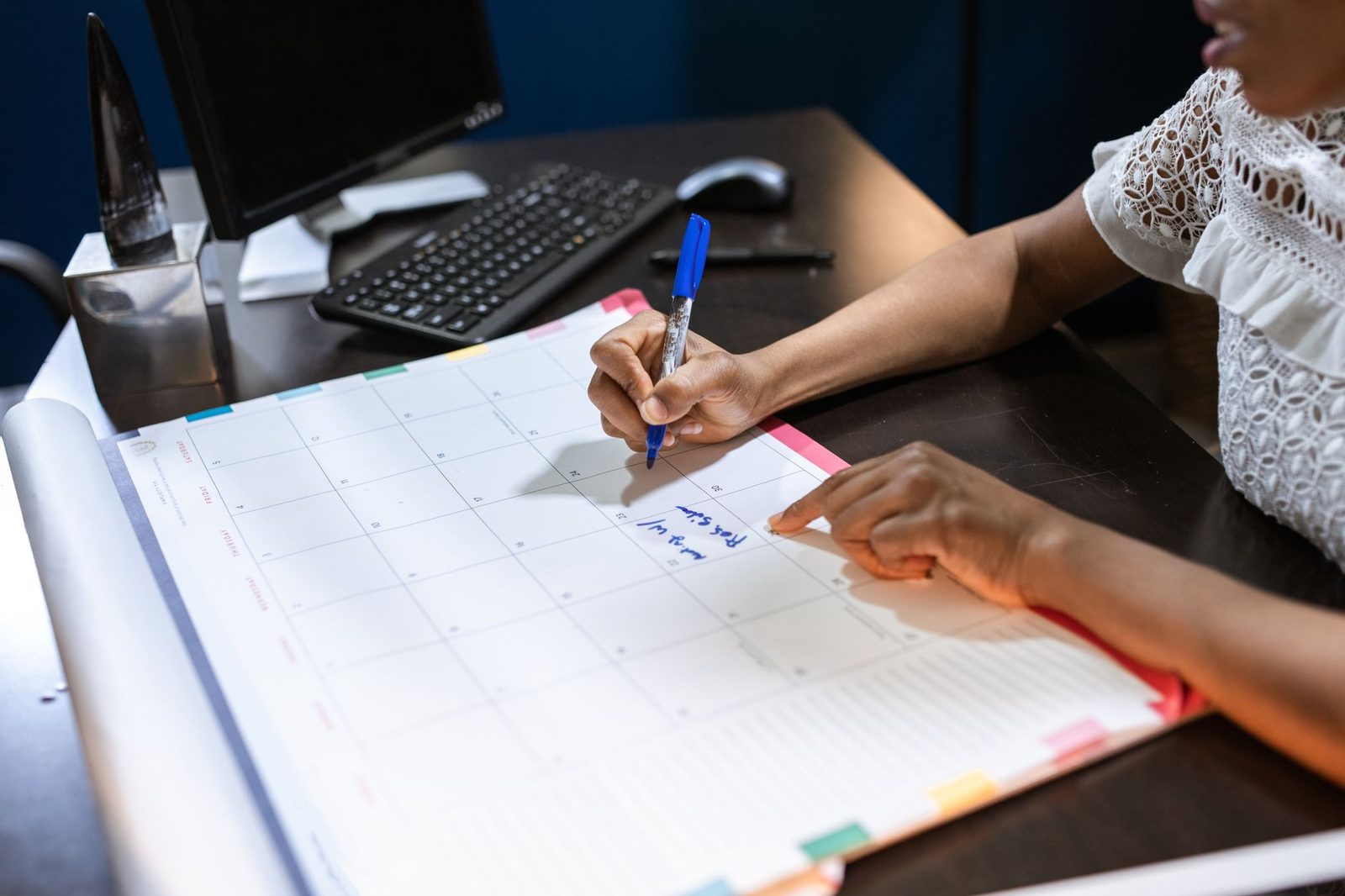Junior student reviewing a packed school calendar to find study hours