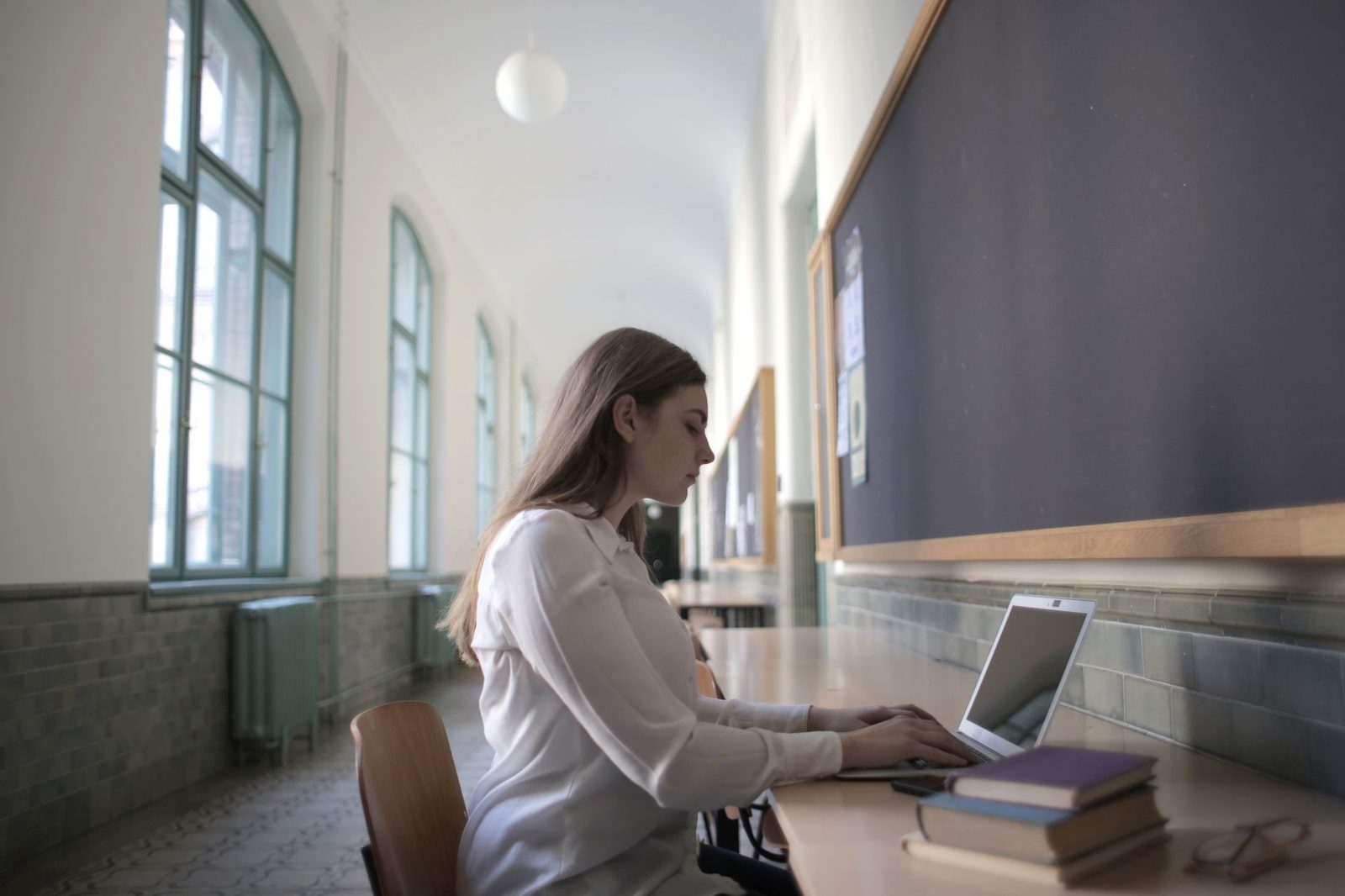Student working on college application on laptop