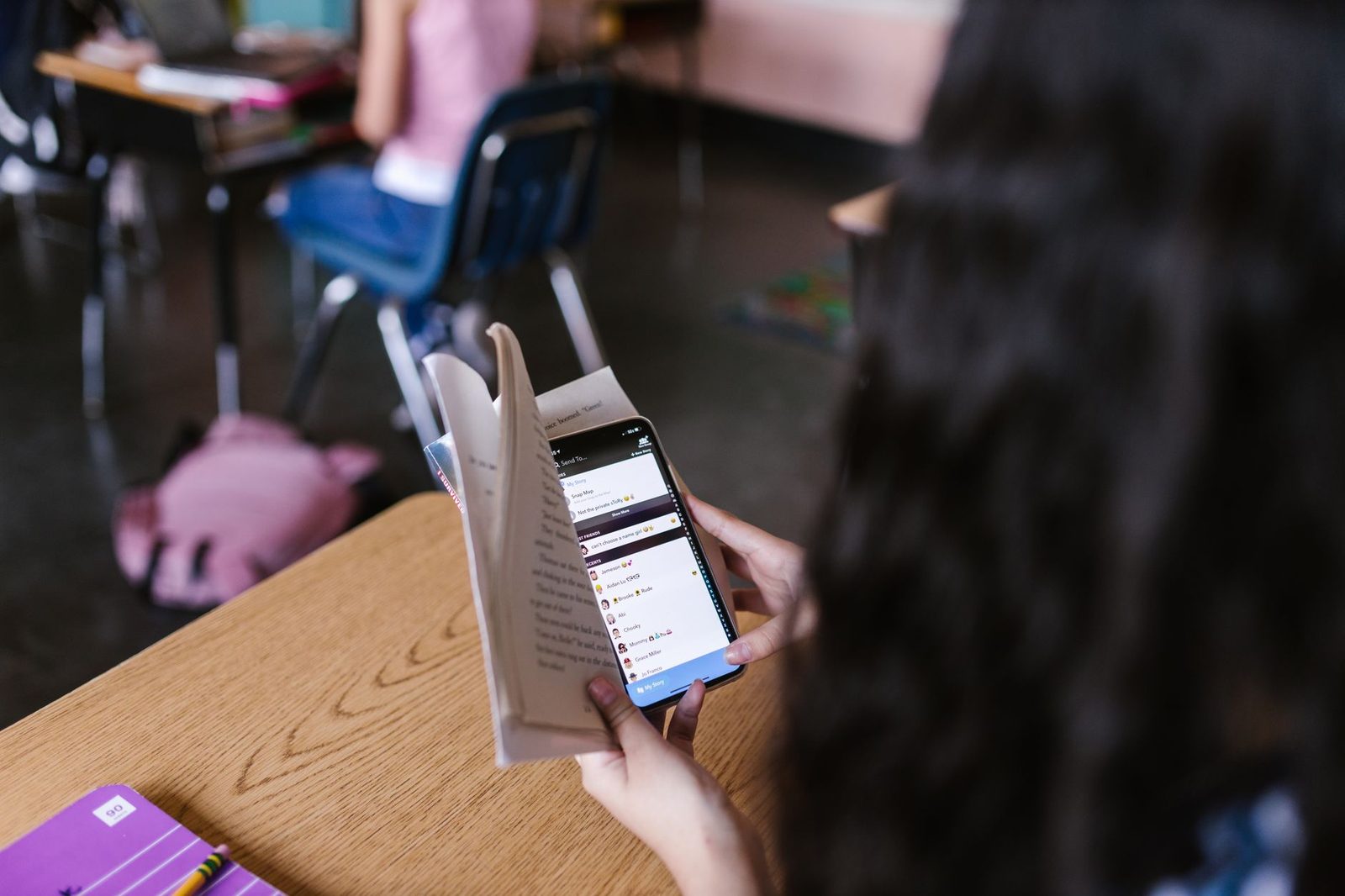 Student reviewing documents at a desk