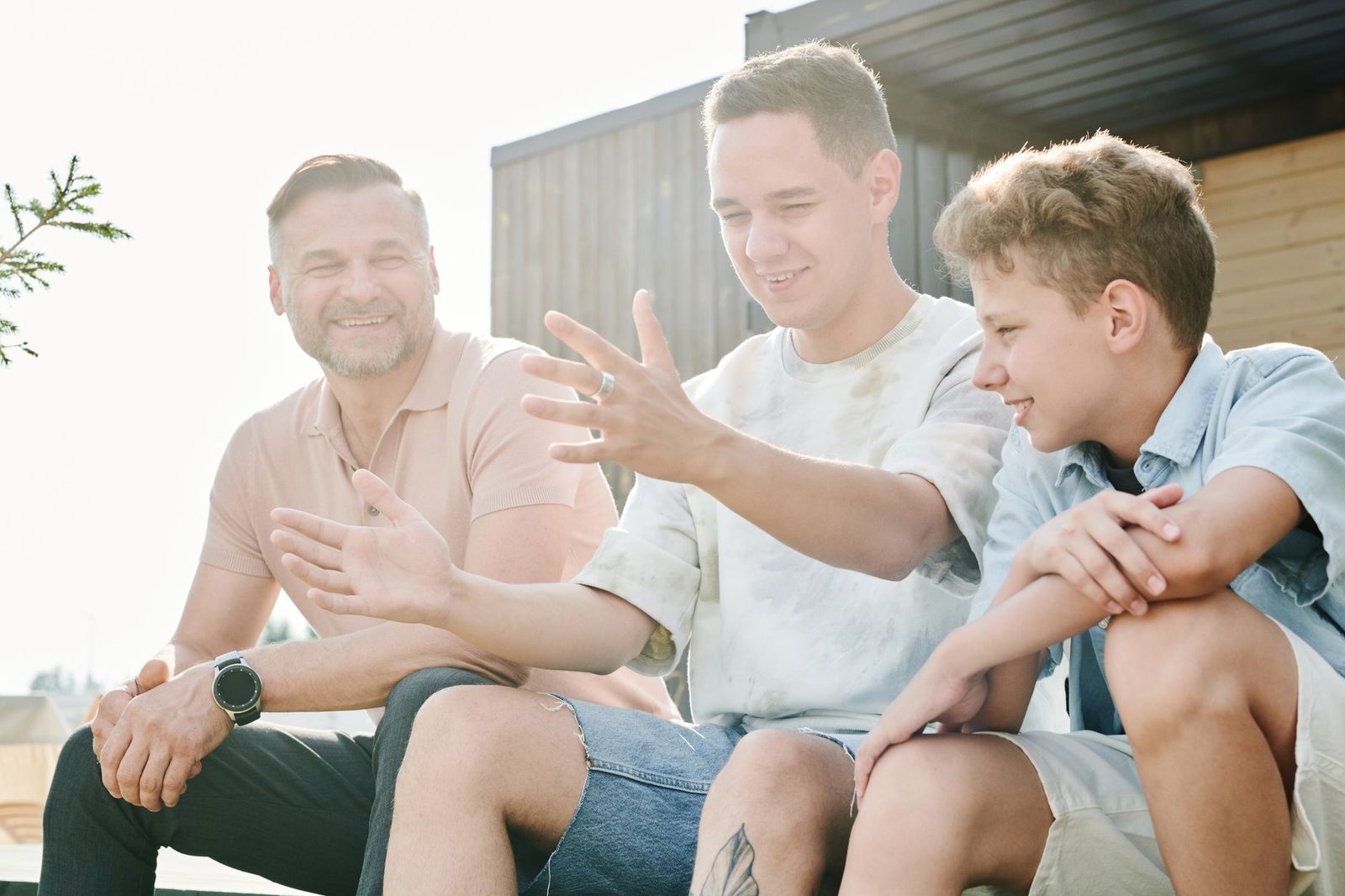 Parent and teenager having a thoughtful conversation at a table