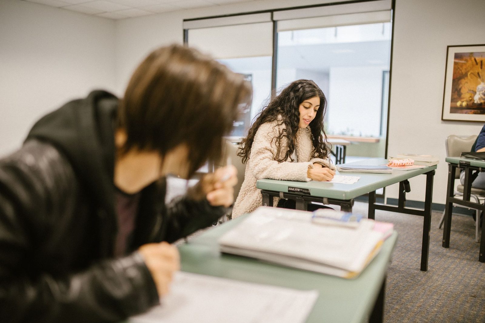 Students studying in college classroom