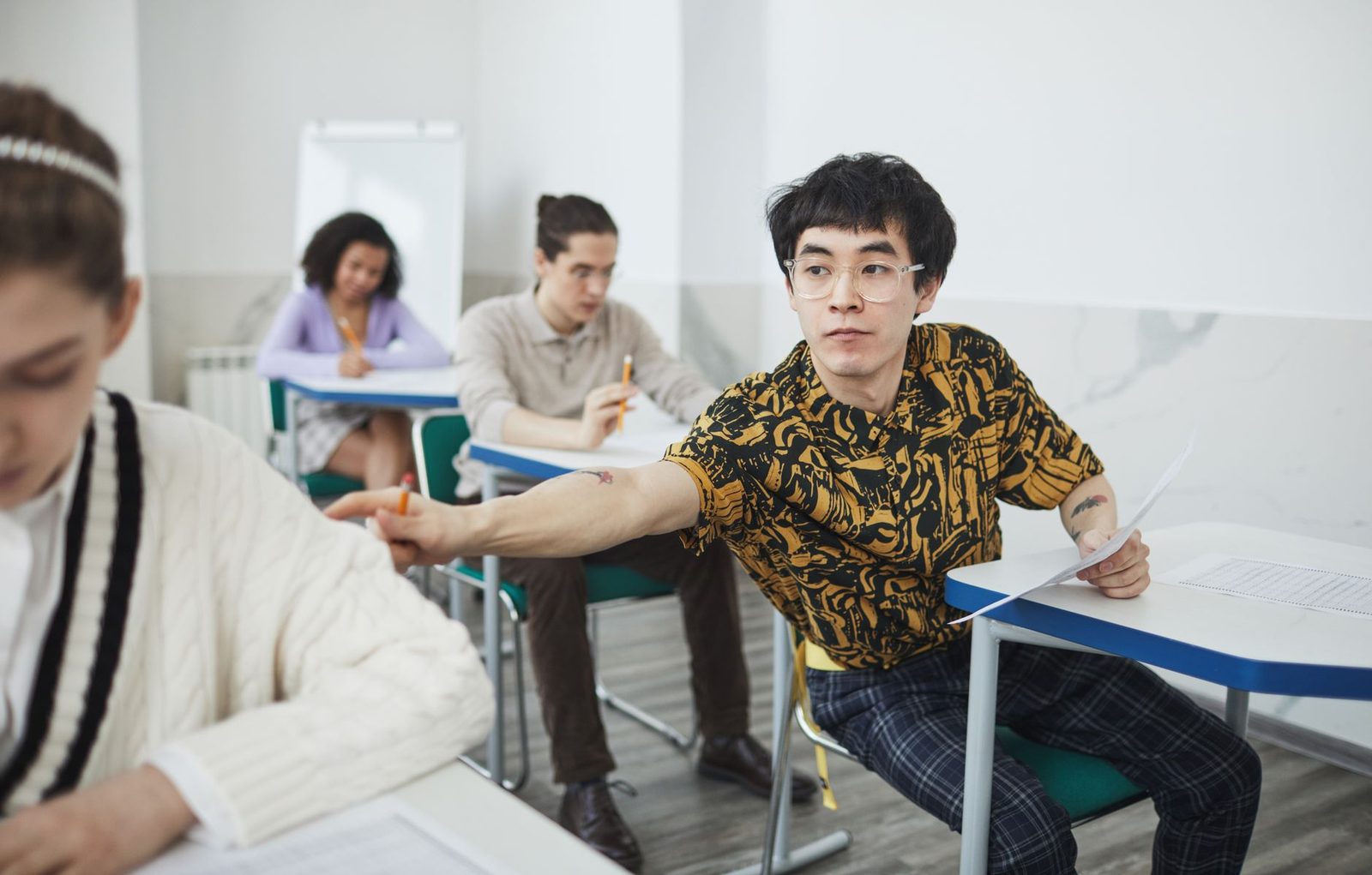 Student looking stressed while studying for a standardized test