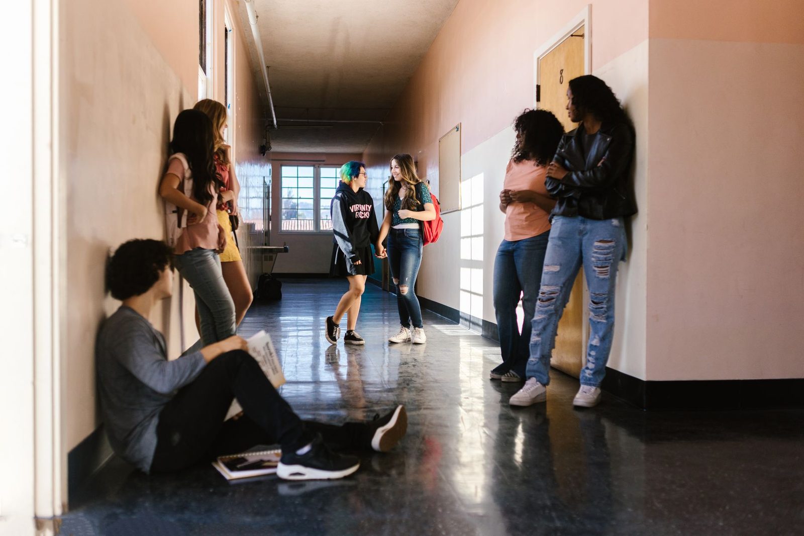 Diverse group of students having a conversation on campus