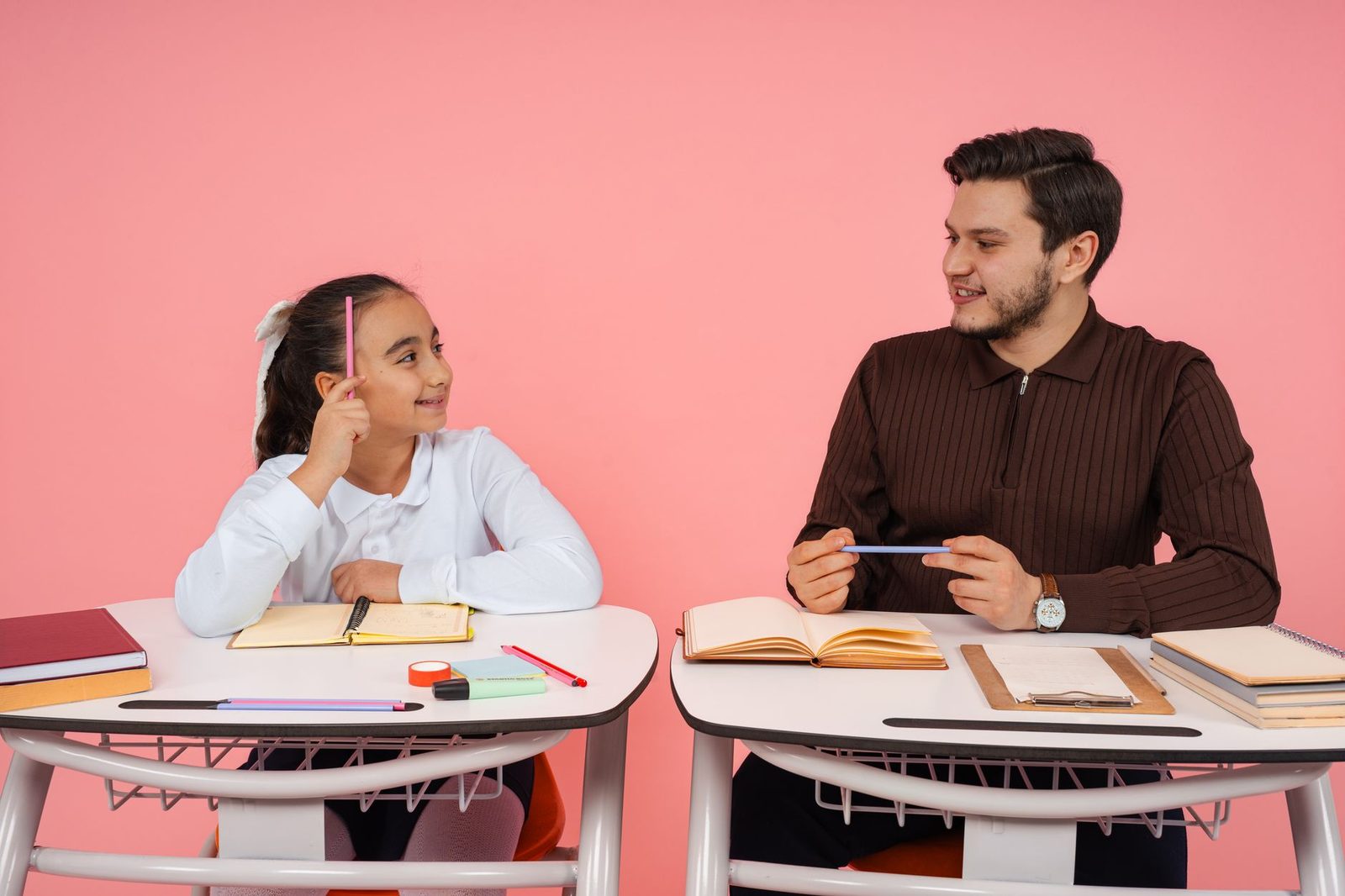 Student organizing papers and planning at a desk