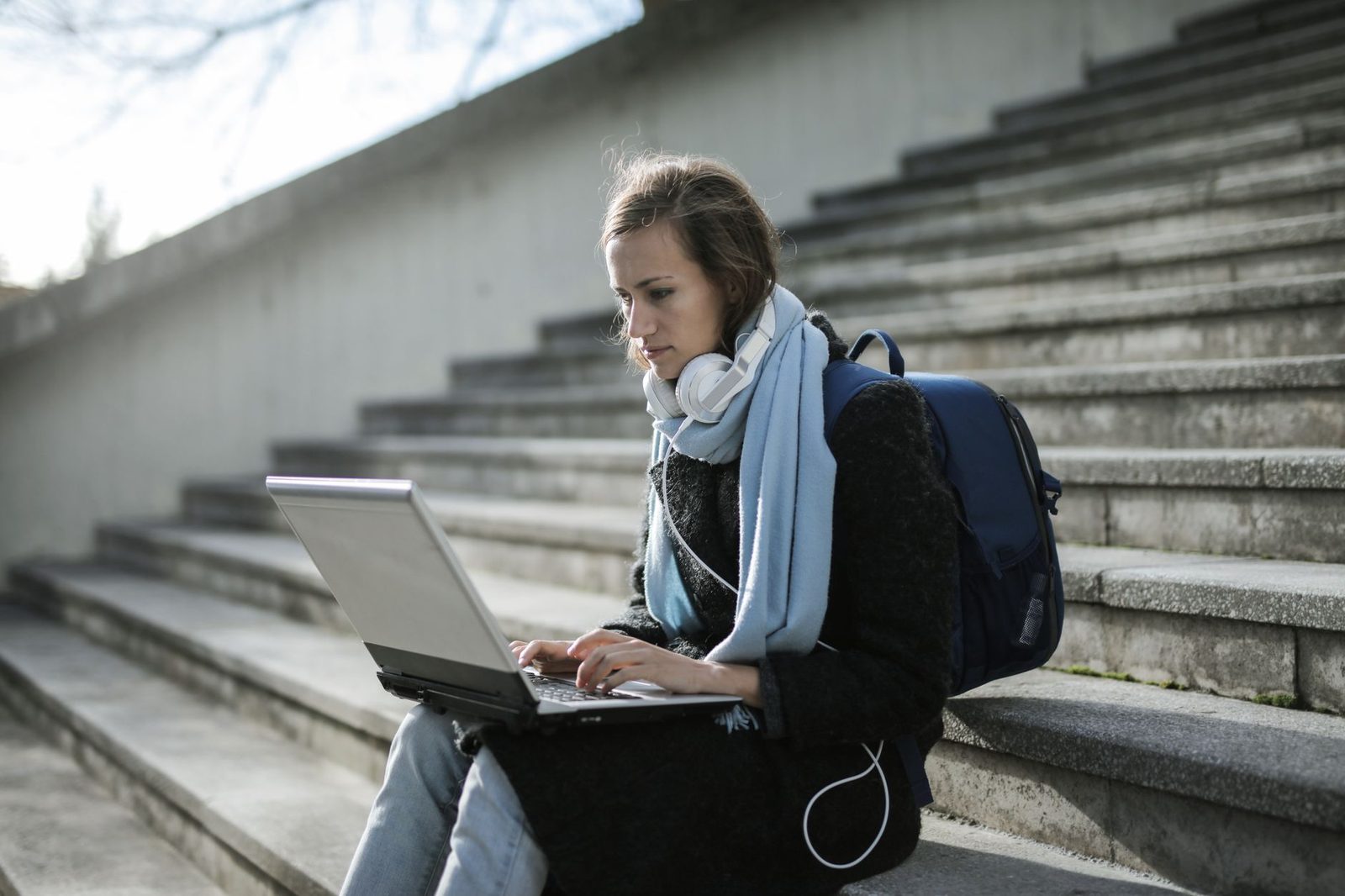 Student waiting anxiously at laptop for college decision